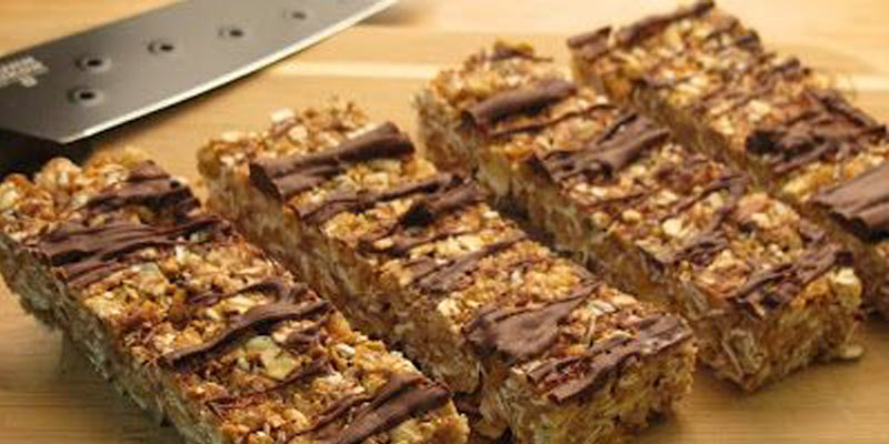 protein bars on cutting board with knife